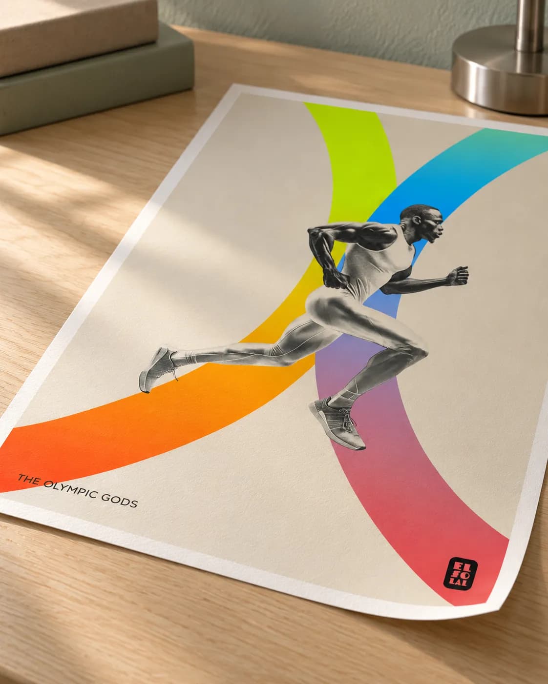 A corner of The Track and Field lifting, the grain of the paper in raking light